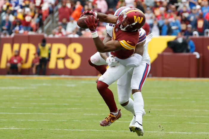 Sep 24, 2023; Landover, Maryland, USA; Washington Commanders cornerback Kendall Fuller (29) intercepts a pass intended for Buffalo Bills wide receiver Gabe Davis (13) at FedExField. Mandatory Credit: Geoff Burke-USA TODAY Sports